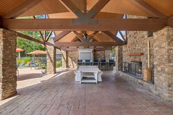 Outdoor cabana with tv, gas grills and wood burning fireplace